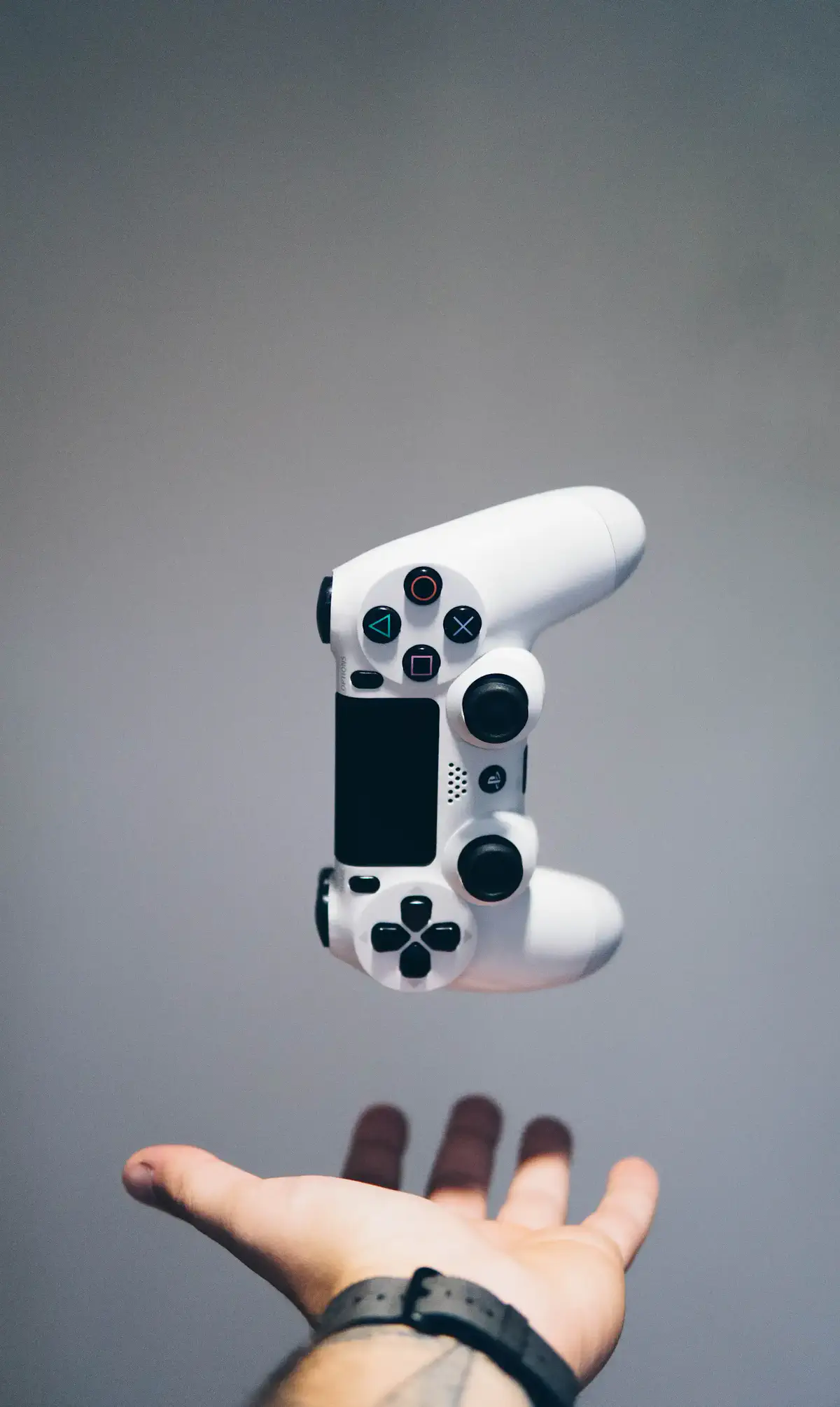 A game controller held in one hand