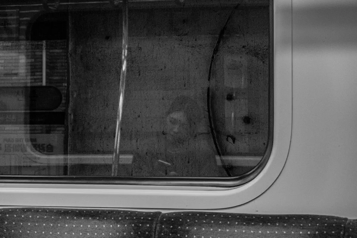 Rain on the window of a moving train