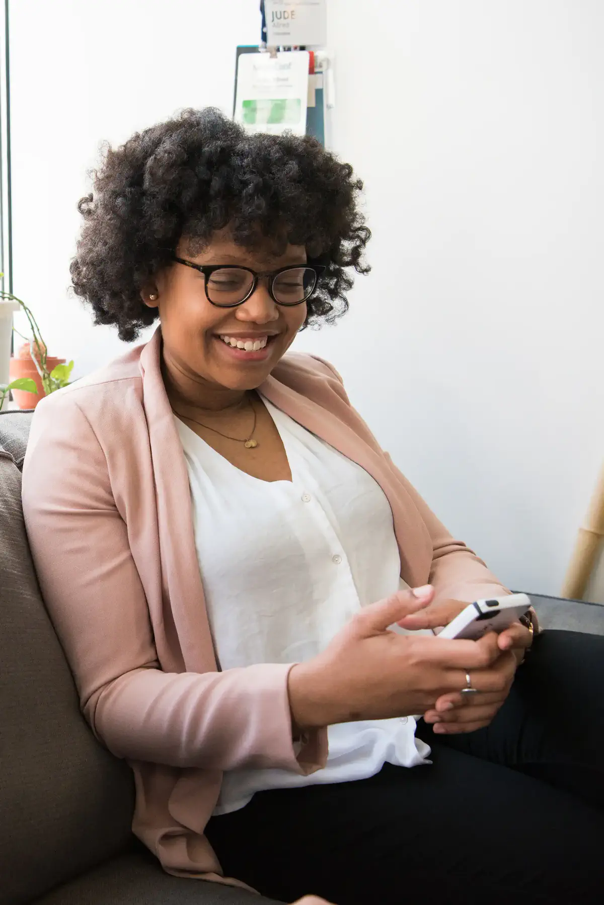 A woman using her phone at home